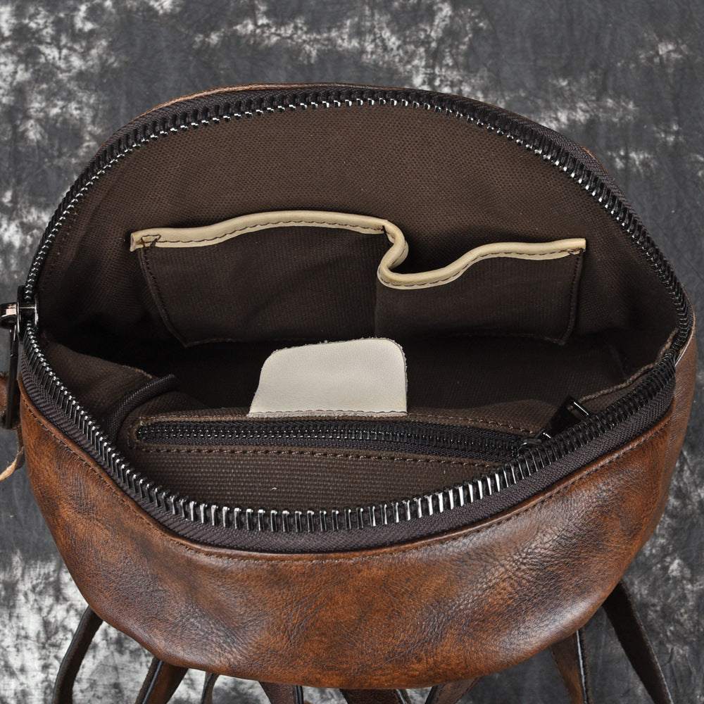 Bark-Grain Leather Backpack in brown hand-rubbed leather with open zip top and organised interior pockets