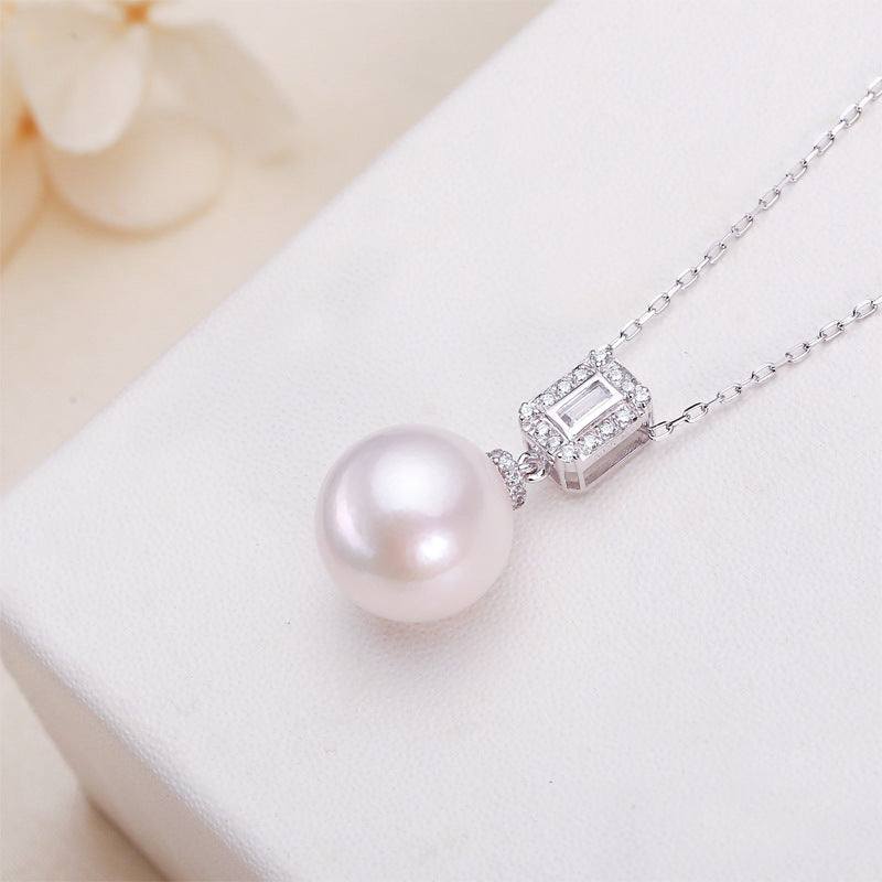 Freshwater Pearl Pendant Necklace with a round white pearl and silver-toned rectangular cubic zirconia setting