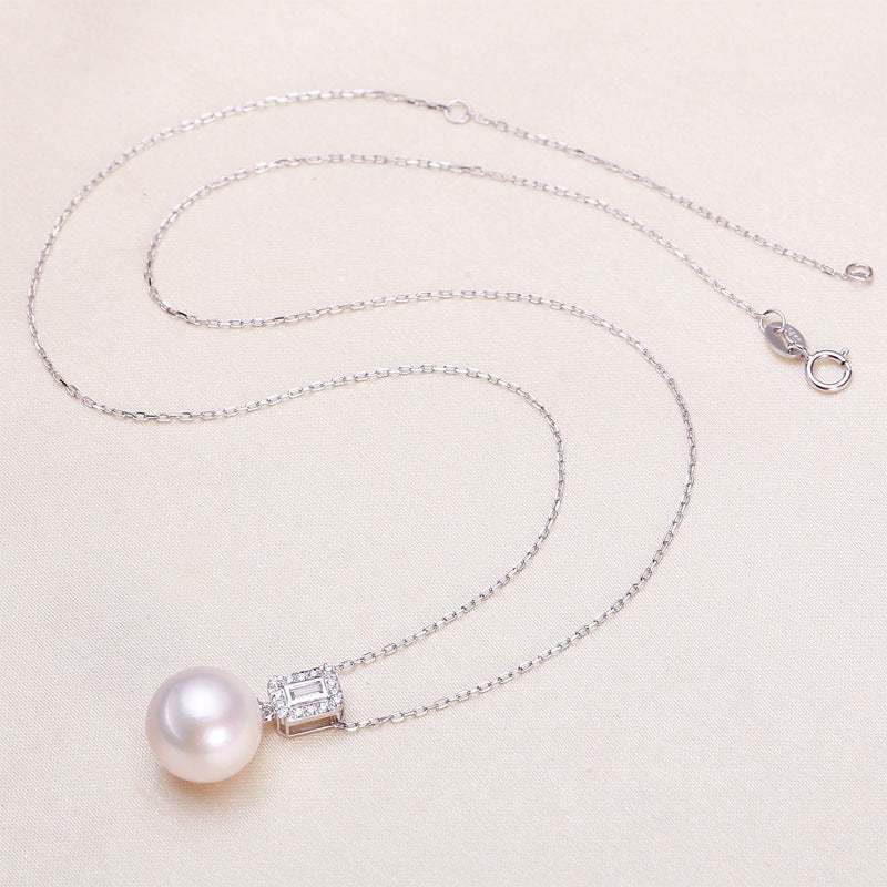 Freshwater Pearl Pendant Necklace with a round white pearl, silver chain, and sparkling rectangular zircon accent
