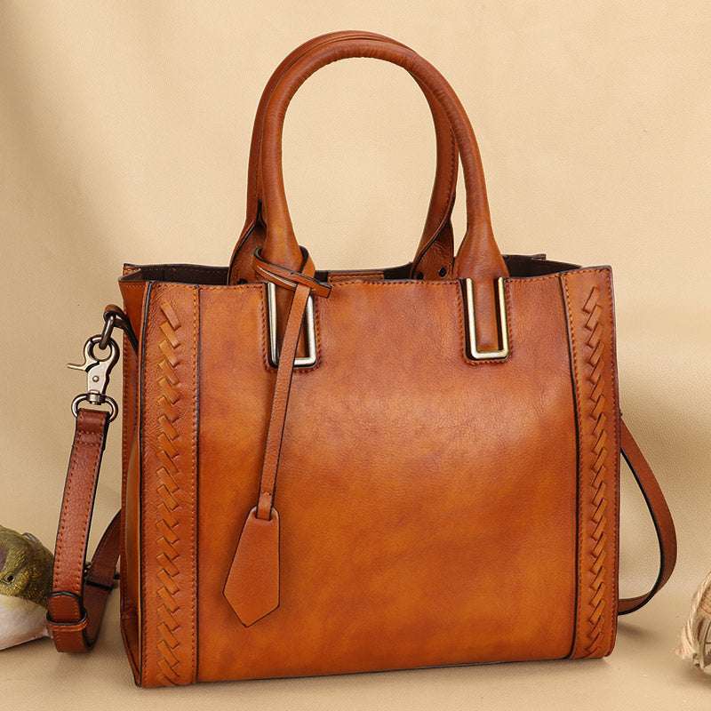 Full-Grain Leather Shoulder Bag in warm brown leather with woven side panels, dual handles, zip top and strap