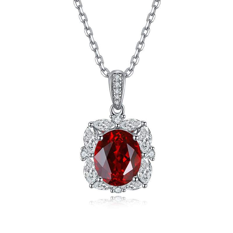 Lab-Created Ruby Halo Pendant Necklace with a deep red oval faceted stone, clear halo accents and silver-tone chain
