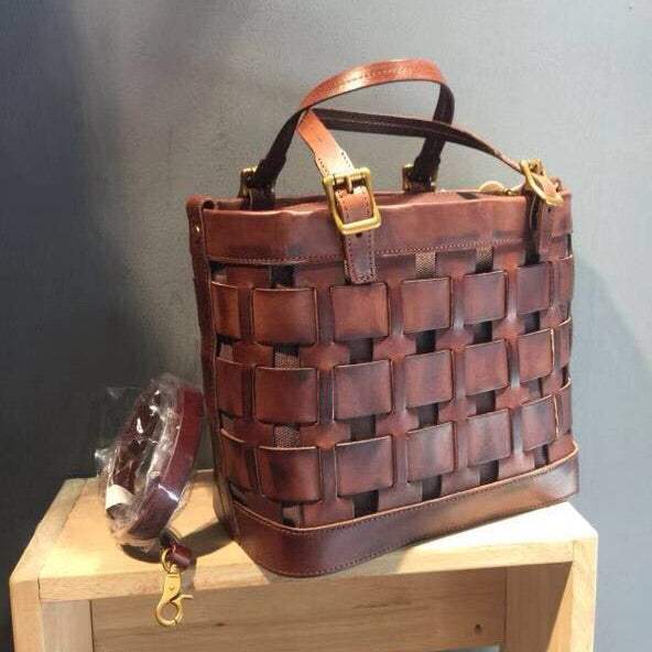 Soft Cowhide Messenger Bag in reddish brown leather with a woven openwork panel, top handles and a long strap