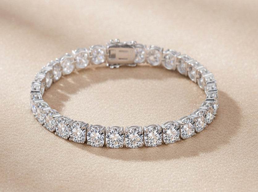 Tennis Bracelet in silver-tone alloy with continuous square-set clear stones and a secure clasp