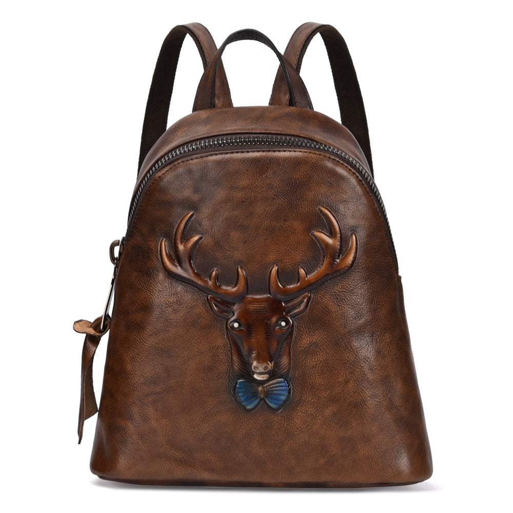 Bark-Grain Leather Backpack in brown leather with hand-rubbed colour and raised deer head motif