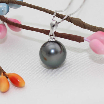 Black pearl pendant with a lustrous round dark grey cultured pearl and a silver-tone bail with gem-set detail