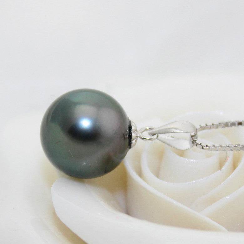Black pearl pendant with a large round, lustrous dark pearl and polished silver-tone bail on a fine chain