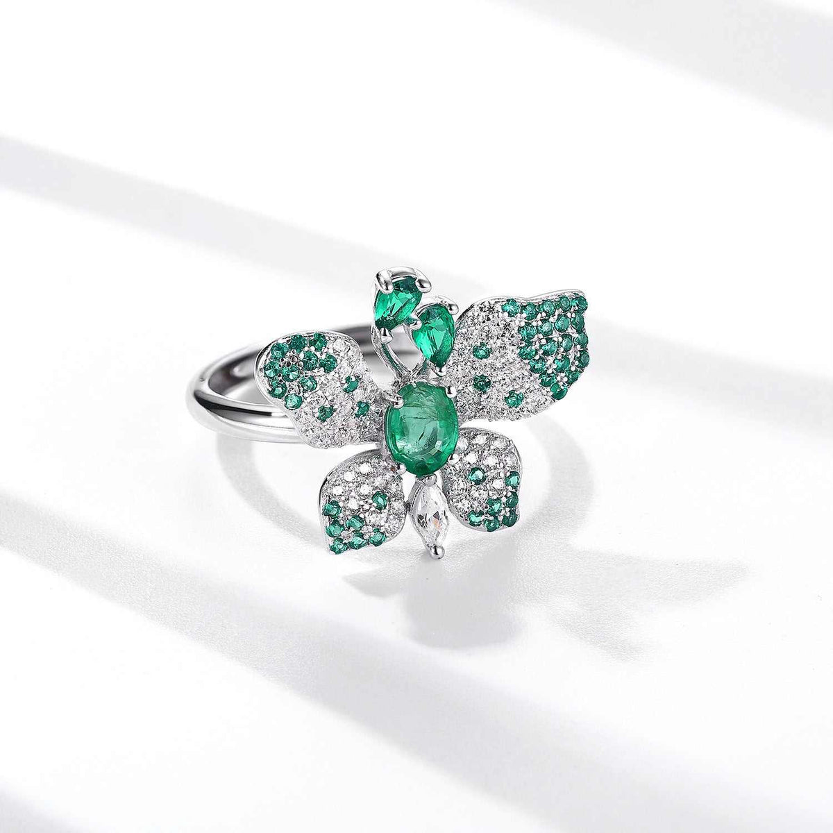 Butterfly Ring in platinum-plated sterling silver with green oval gemstone and pavé butterfly wings