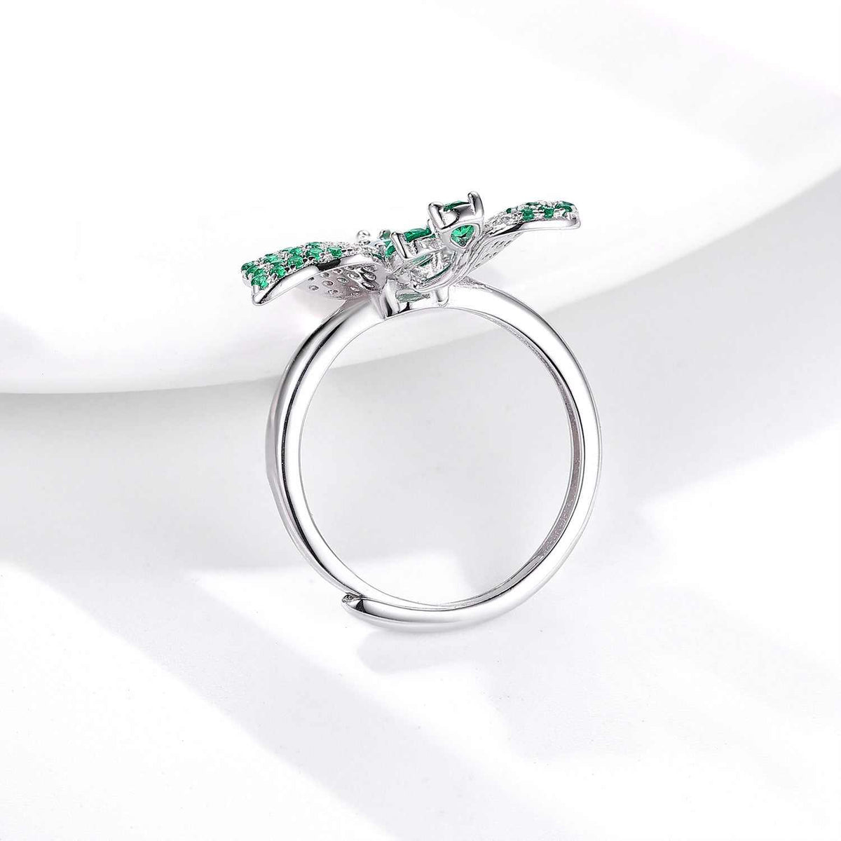 Butterfly Ring in silver-tone metal with green stones, open adjustable band and detailed butterfly design