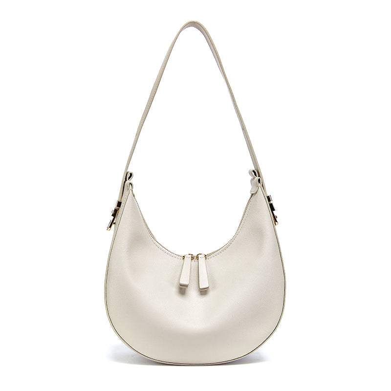 Cowhide Crossbody Bag in pale grey-white leather with a smooth finish, curved shape and double zip pulls
