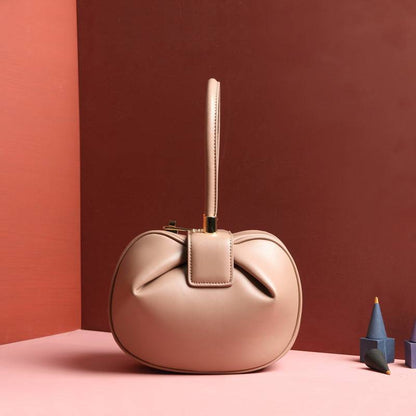 Cowhide Dumpling Tote Bag in blush pink leather with a rounded slouchy shape and single top handle