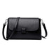 Cowhide Shoulder Bag in black leather with a plain textured finish, flap closure and adjustable shoulder strap