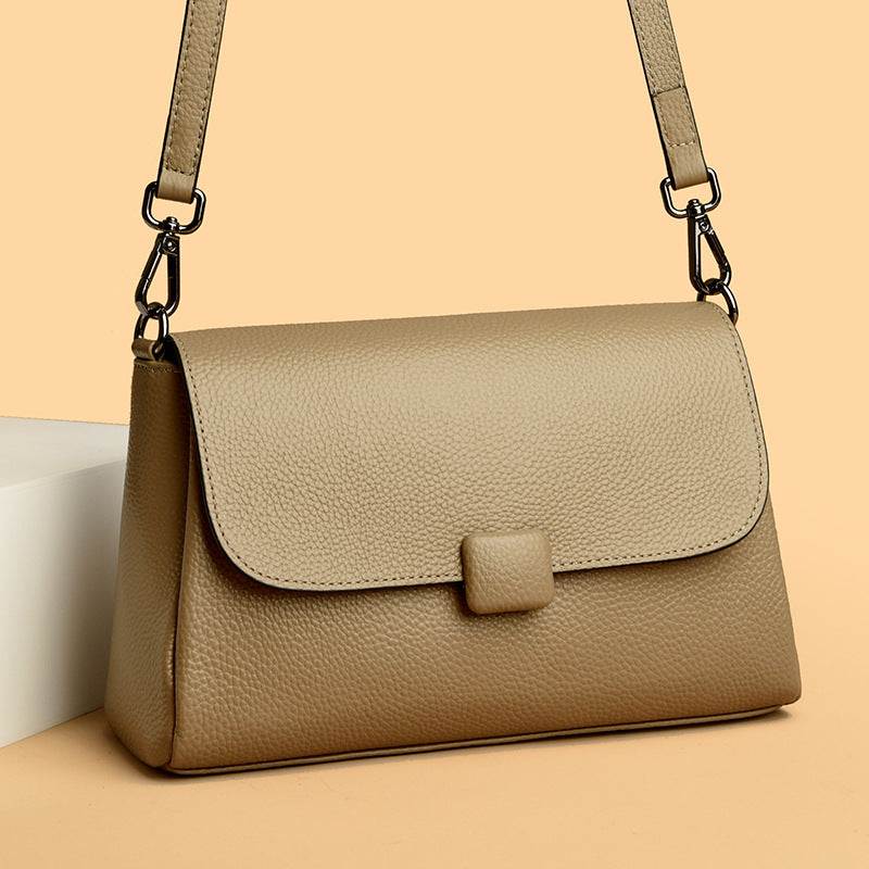 Cowhide Shoulder Bag in caramel-toned leather with a plain pebbled finish, flap closure and adjustable strap