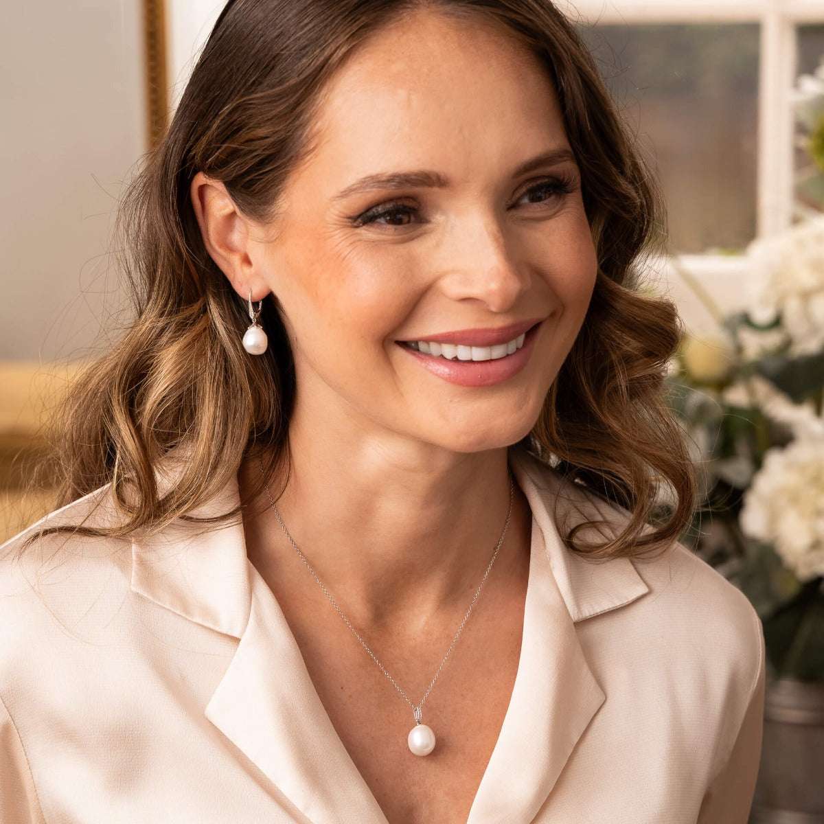 Elements Gold white gold drop earrings with irregular white pearls and sparkling topaz accents
