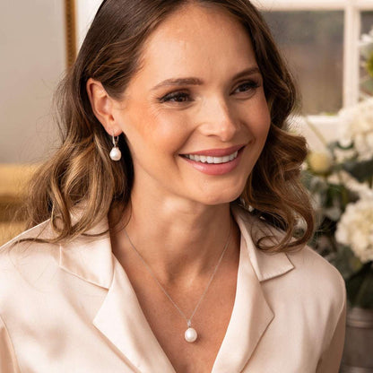 Elements Gold white gold drop earrings with irregular white pearls and sparkling topaz accents