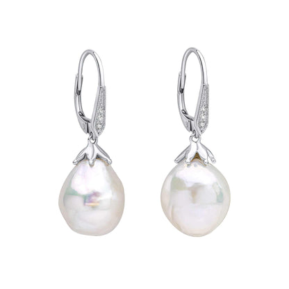 Elements Gold white gold drop earrings with oversized lustrous baroque pearls and sparkling pavé-set topaz accents