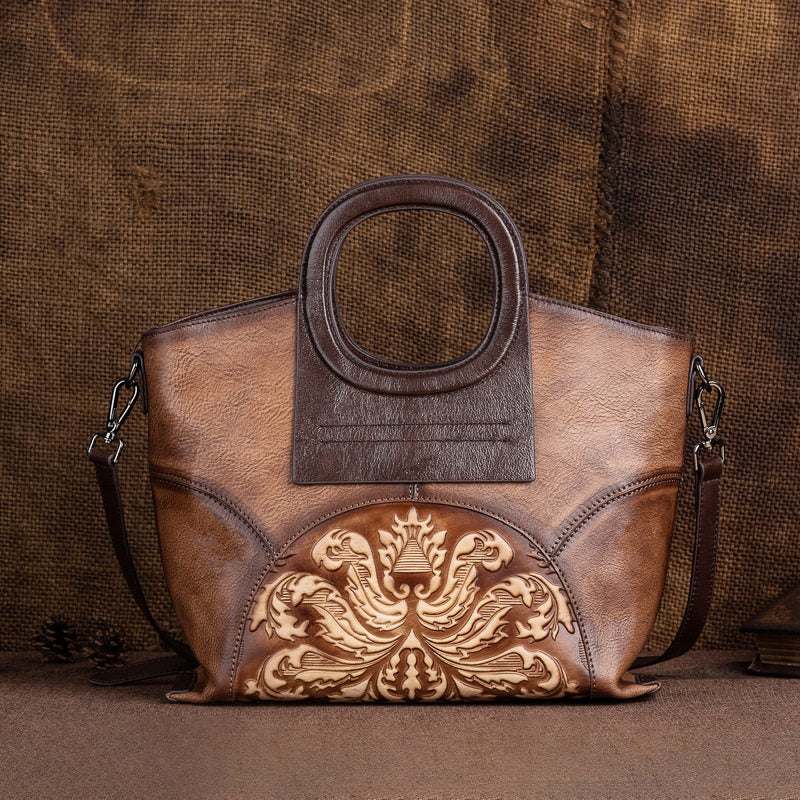 Embossed Floral Leather Crossbody Bag in brown leather with ornate floral embossing and a structured rectangular shape