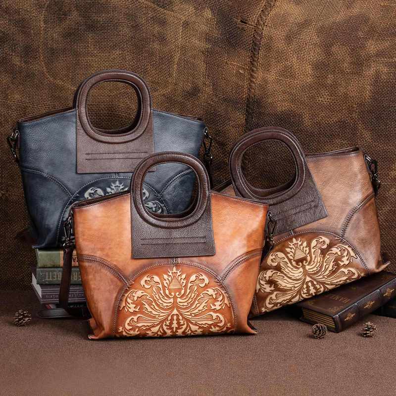 Embossed Floral Leather Crossbody Bag in brown, tan and charcoal leather, with ornate floral panels and rounded handles.