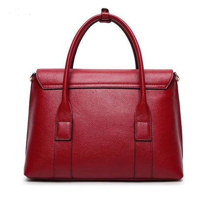 Full-Grain Cowhide red leather shoulder bag with structured shape, twin handles, flap top and polished grain