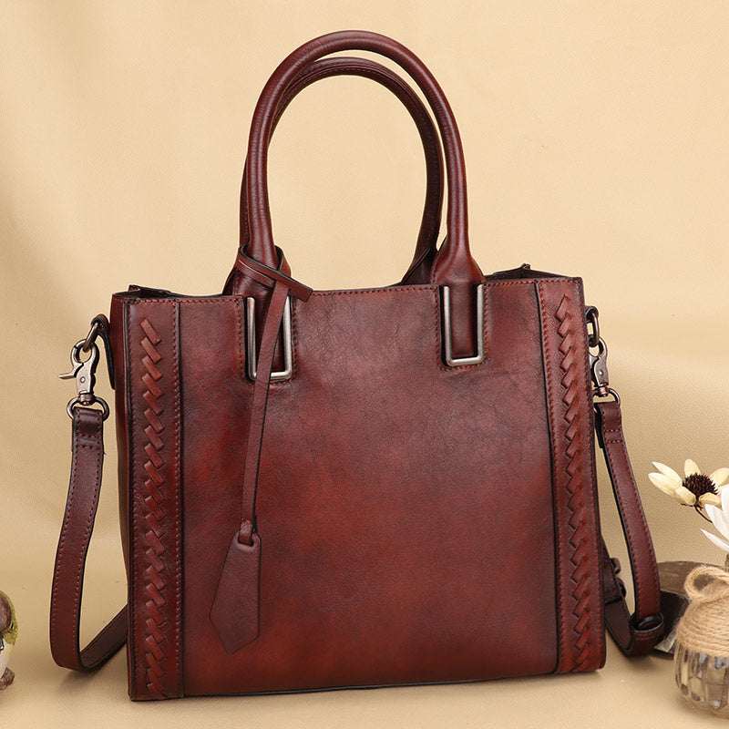 Full-Grain Leather Shoulder Bag in burgundy leather with woven side panels, double handles, and detachable strap