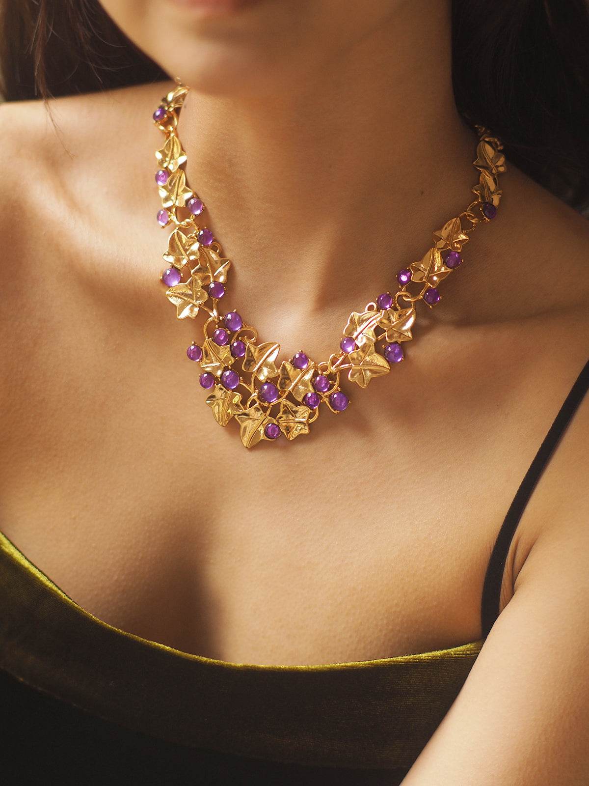 Grape Cluster Gold-Plated Necklace with purple faceted stones and ornate gold-toned leaf details