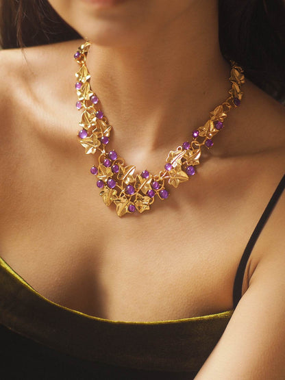 Grape Cluster Gold-Plated Necklace with purple faceted stones and ornate gold-toned leaf detailing