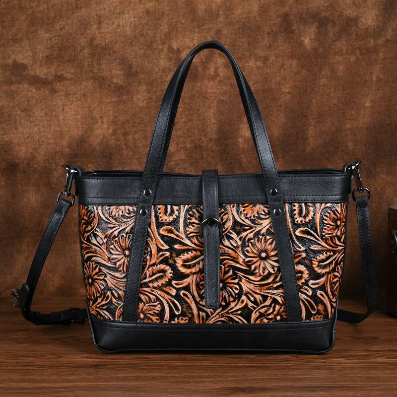 Hand-Carved Cowhide Crossbody Bag in black leather with copper floral carving, contrast trim, and double handles