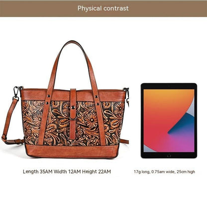 Hand-Carved Cowhide Crossbody Bag in brown leather with floral carved panels, contrast trim and dual straps
