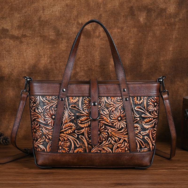 Hand-Carved Cowhide Crossbody Bag in brown leather with intricate floral carving, contrast trim, and shoulder straps