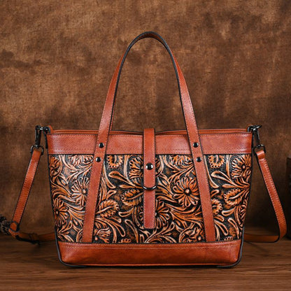 Hand-Carved Cowhide Crossbody Bag in brown leather with floral carved panel, contrast trim and shoulder strap