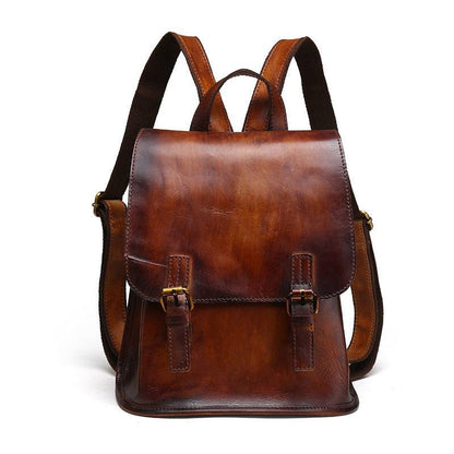 Hand-Painted Cowhide Leather Backpack in rich brown leather with a smooth flap, buckled straps and compact shape