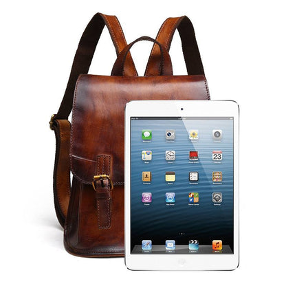 Hand-Painted Cowhide Leather Backpack in retro brown leather with a structured shape, buckled front strap and shoulder straps