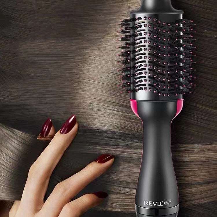Hot Air Styling Comb with black tourmaline ceramic barrel, pink accents, and vented bristles for smoothing hair