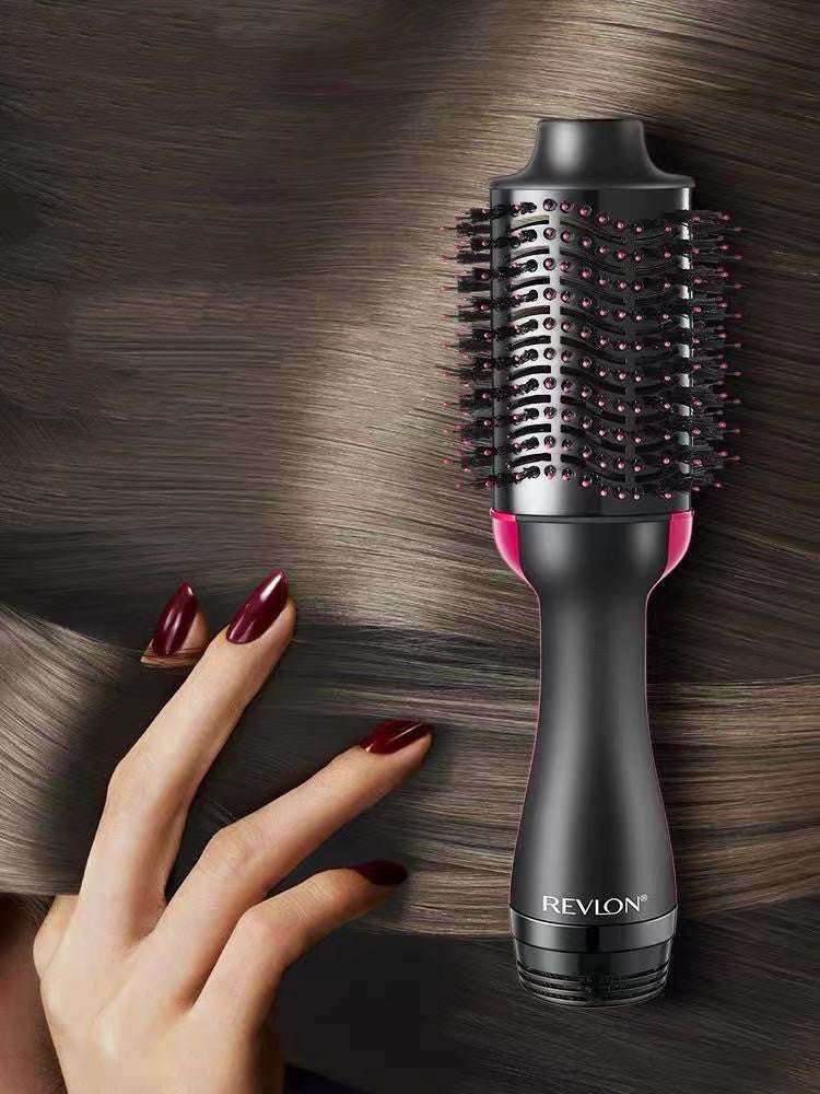Hot Air Styling Comb with black ceramic barrel, pink accents, bristle teeth and ergonomic handle
