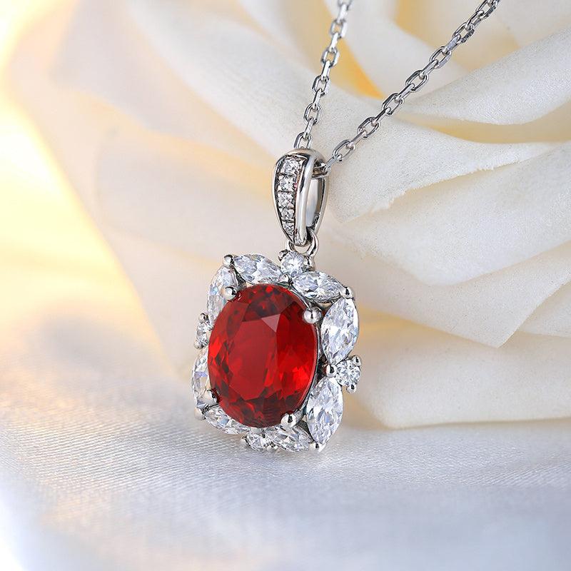 Lab-Created Ruby Halo Pendant Necklace with oval red gemstone and sparkling silver halo setting