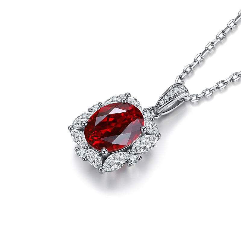 Lab-Created Ruby Halo Pendant Necklace with a deep red oval faceted centre stone, clear halo accents and silver-tone chain