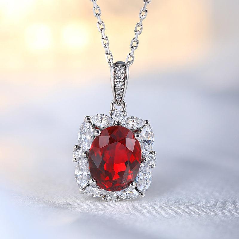 Lab-Created Ruby Halo Pendant Necklace with a faceted deep red oval stone, clear halo accents and silver-tone setting