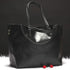 Metallic Cowhide Shoulder Bag in black leather with a soft-sided shape, twin handles, and detachable strap