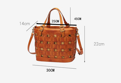 Soft Cowhide Messenger Bag in warm cognac brown leather with a woven openwork panel, top handles and shoulder strap