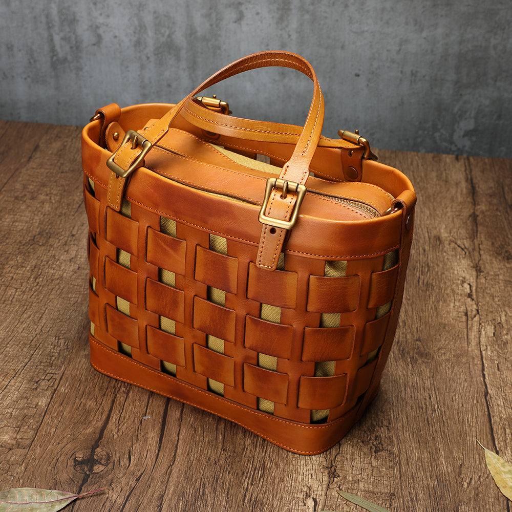 Soft Cowhide Messenger Bag in warm tan brown leather with woven openwork panels, buckled straps and top handles