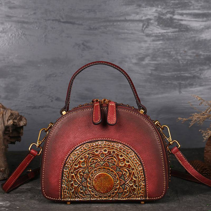 Suede Cowhide Top-Handle Handbag in red with a decorative embossed patterned front panel and detachable shoulder strap