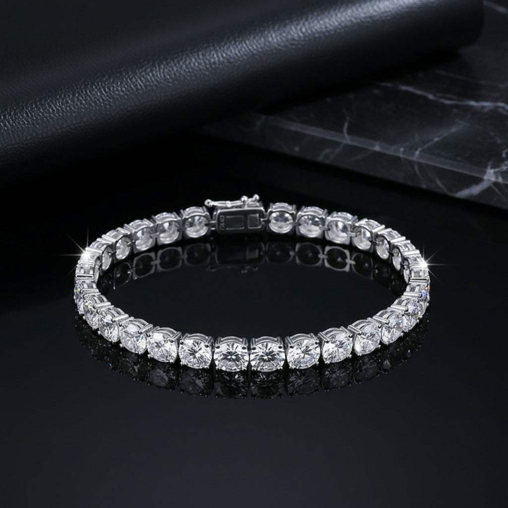 Tennis Bracelet in silver-tone alloy with a continuous row of square-set clear stones and a box clasp