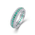 Three-Row Pavé Eternity Ring in silver-tone metal with green and clear pavé stones, fully set around the band