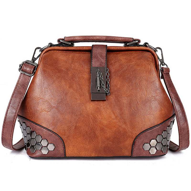 Vegan Leather doctor bag in brown with crossbody strap, top handles, twist lock and honeycomb rivet panels