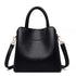 Vegan Leather Bucket Bag in black pebbled PU with a structured shape, top handle, zip closure and shoulder strap