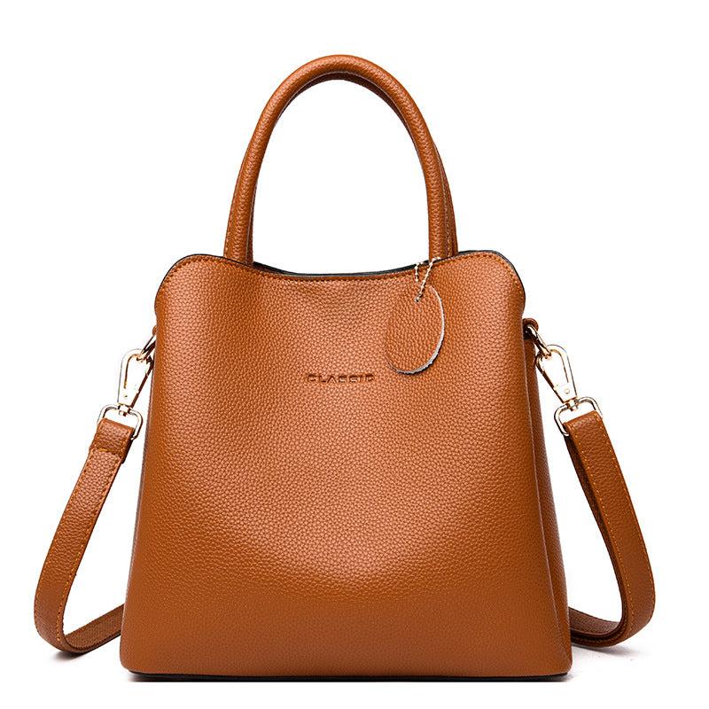 Vegan Leather Bucket Bag in brown litchi-grain texture with top handles and detachable shoulder strap