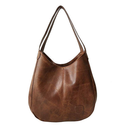 Vegan Leather Tote Bag in brown with a soft-sided finish, long shoulder straps and stitched panel detailing