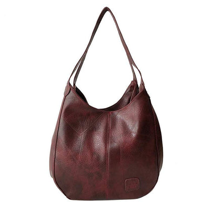 Vegan Leather Tote Bag in burgundy PU leather with a soft slouchy shape and double shoulder straps
